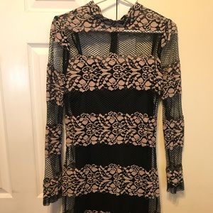 black and tan lace mini dress with floral design